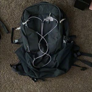 Pinkish purple and black North face backpack